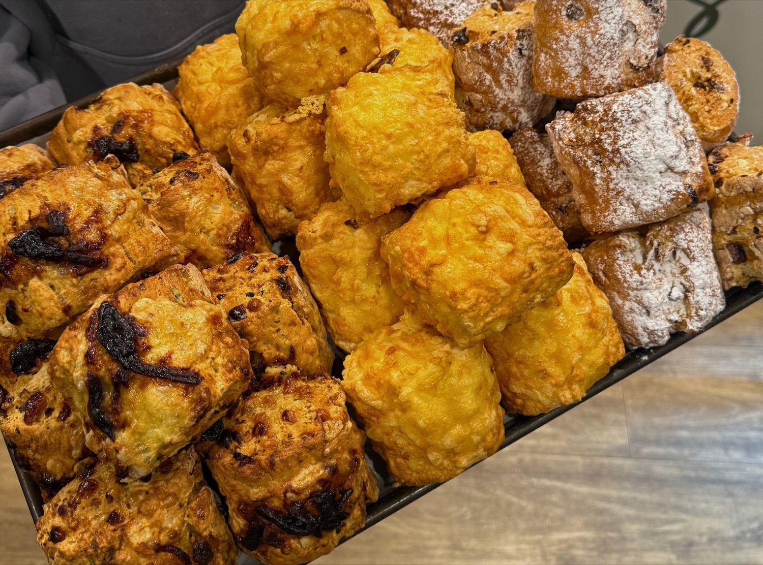 A tray of golden scones, some gluten-free